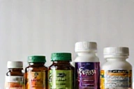 Group of natural supplements including vitamins for men